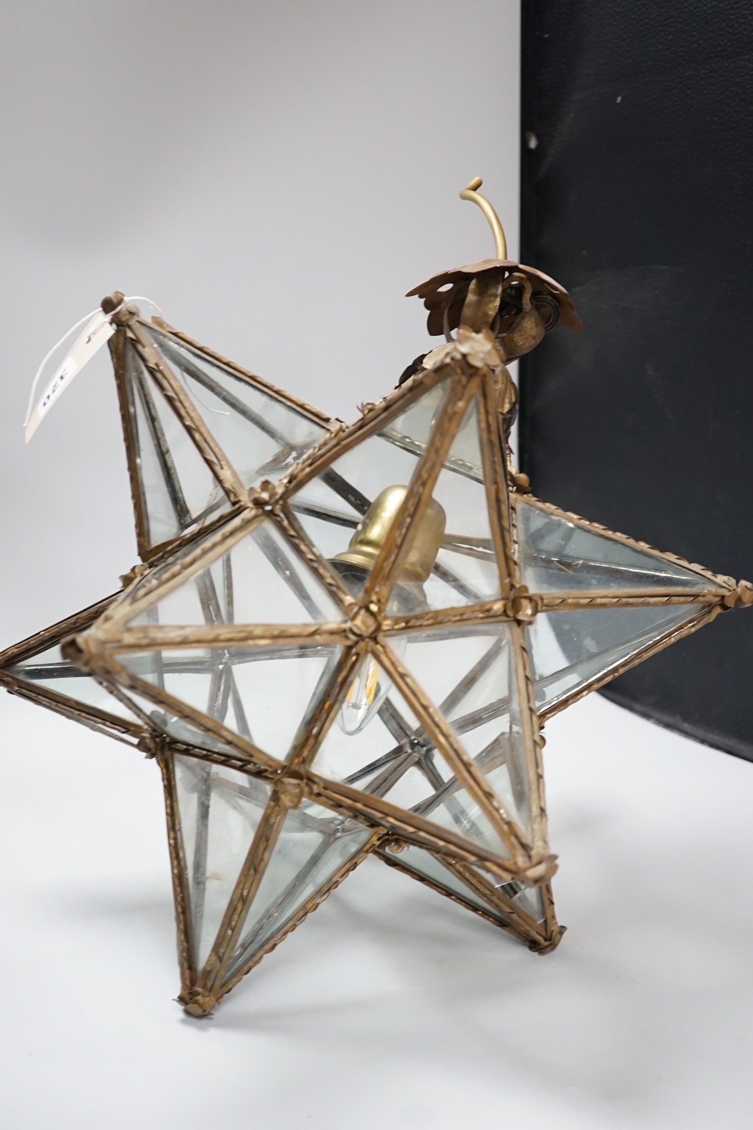 A cut glass four branch electrolier, star shaped gilt metal ceiling shade and a 1970's perspex ceiling shade